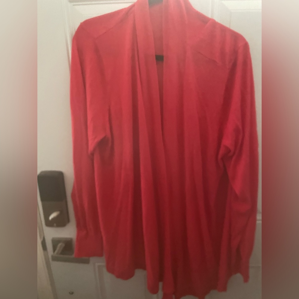 Coral cardigan covers bum